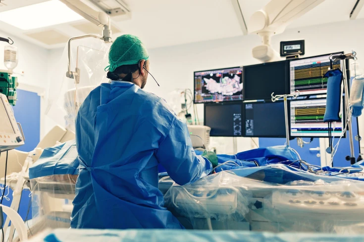 A doctor performs an angiography surgery on a patient in hospital