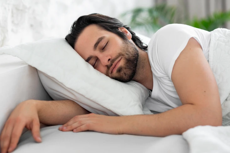 Man sleeping soundly in bed