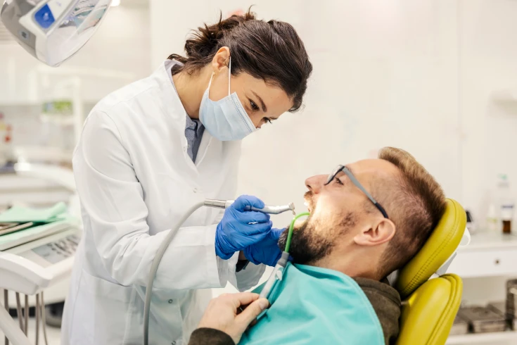 Man having his teeth extracted by the dentist