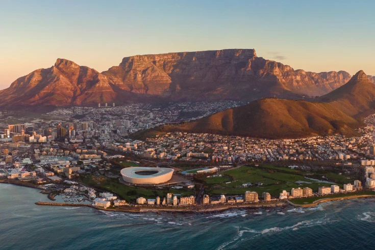 View of Cape Town with an arena, city buildings and the Table Mountains in the background
