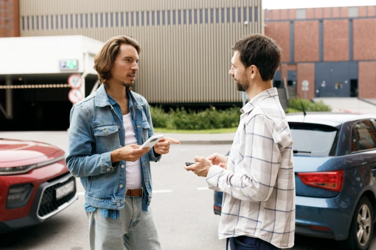 Image of two drivers talking to each other