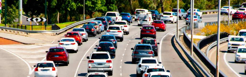 Cars sit bumper to bumper in a traffic jam.