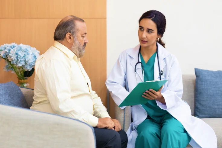Man having a consultation with his doctor as they consider gastric band surgery