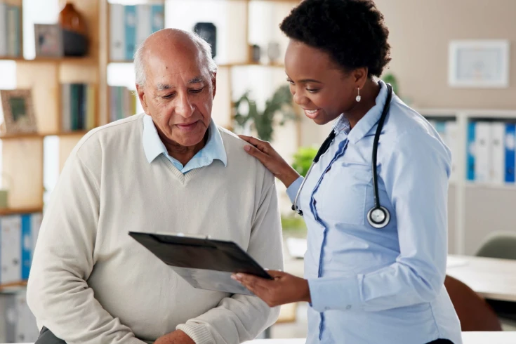 Man talking to a doctor, getting ready for prostate (or TURP) surgery
