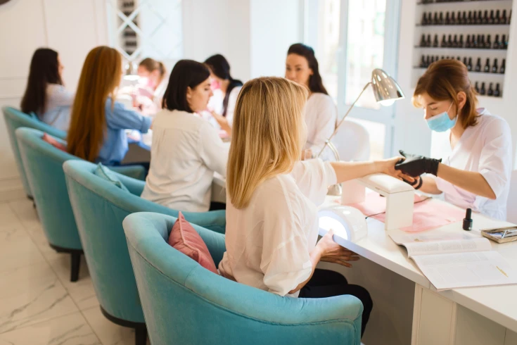 An image of a group of women in a nail spa