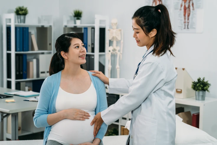 Woman having a consultation with her obstetrician for a planned caesarean section