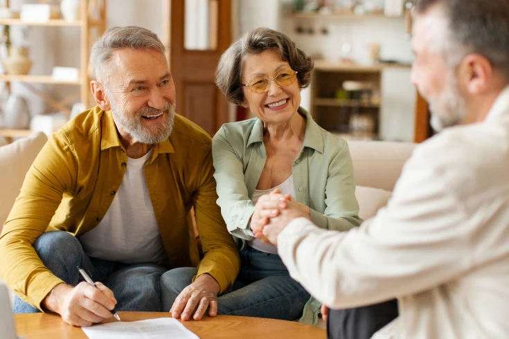 Pensioners consulting a broker for a home loan