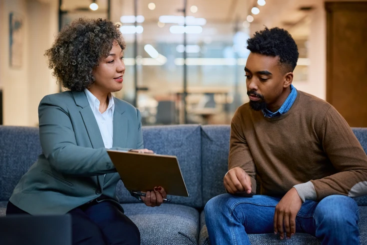 A self-employed man consulting a broker for a home loan